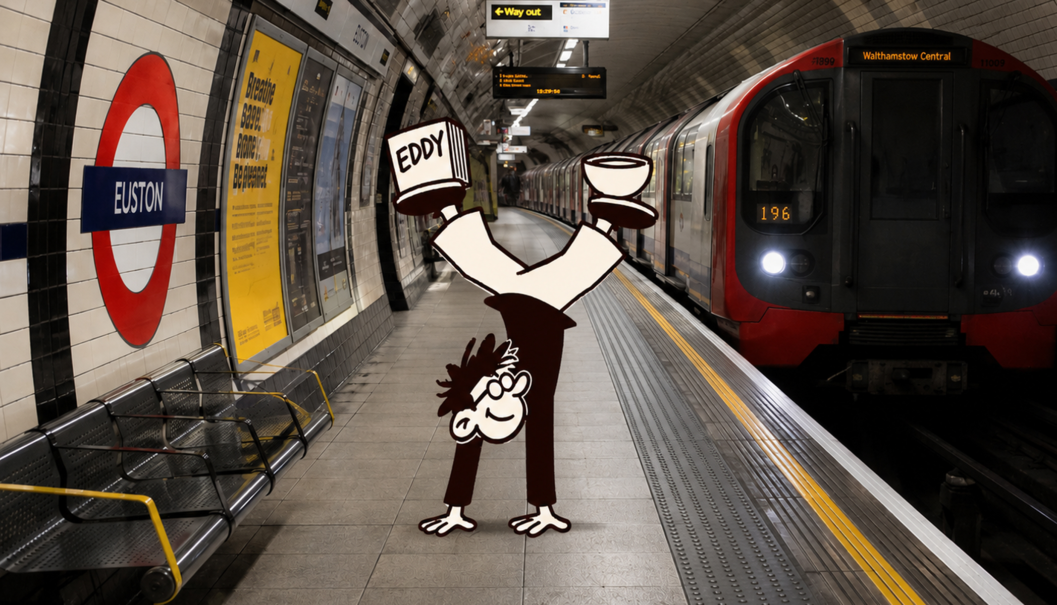 Eddy doing a handstand on the platform at Euston tube station